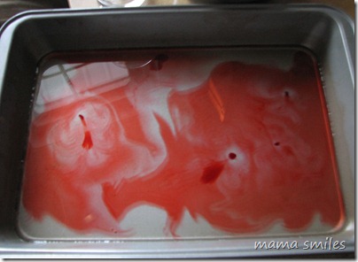 food coloring drops dispersing through water