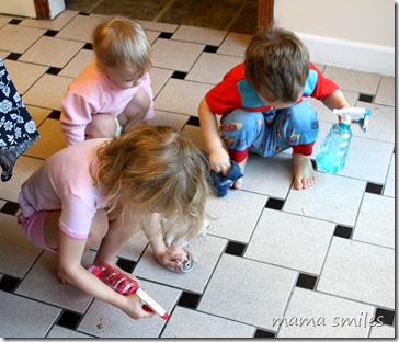 Cleaning the floor with spray bottles