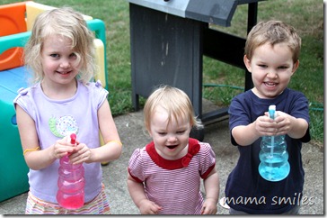 Playing with spray bottles outside
