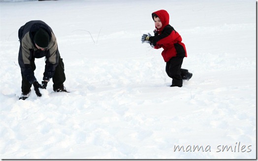 playing in the snow - it's hard to pack powder! 
