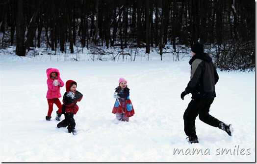playing in the snow - throwing snowballs!
