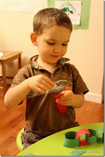 Johnny works on a paper chain