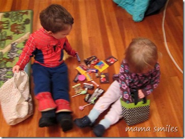 Johnny and Lily sort through their trick or treating loot