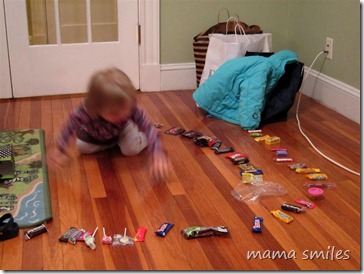 Lily admires her trick or treating candy