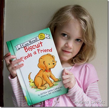 Emma with a library book, home from her first day of school