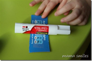 tape the glue stick to the cardboard