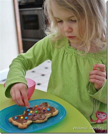 Putting candies in just the right spots on the cookies