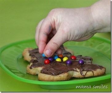 decorating cookies makes good fine motor practice for toddlers