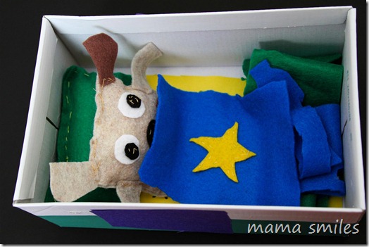 child-sewn stuffed dog with shoebox house