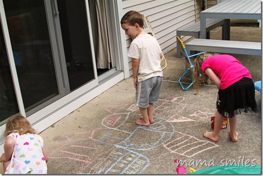 collaborative pretend play with sidewalk chalk