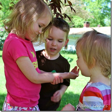 Johnny and Lily admire Emma's caterpillar