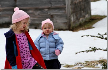 Emma and Lily explore the yard