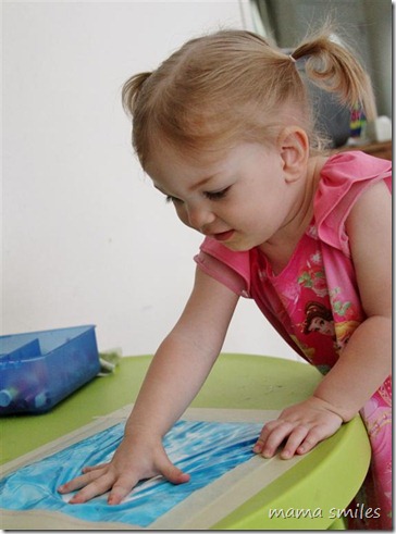 Lily explores textures and watches the paint react