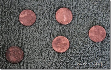 The side of the pennies that faced up after soaking in olive oil