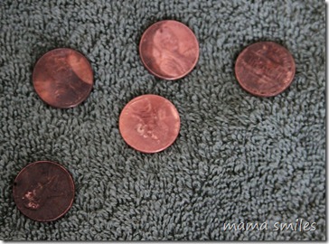 The side of the pennies that faced down after soaking in olive oil