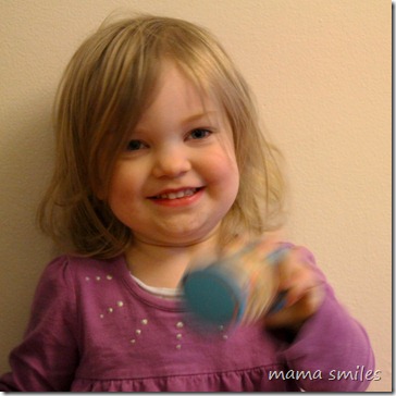 Lily with the Music Together mini-rainmaker shaker