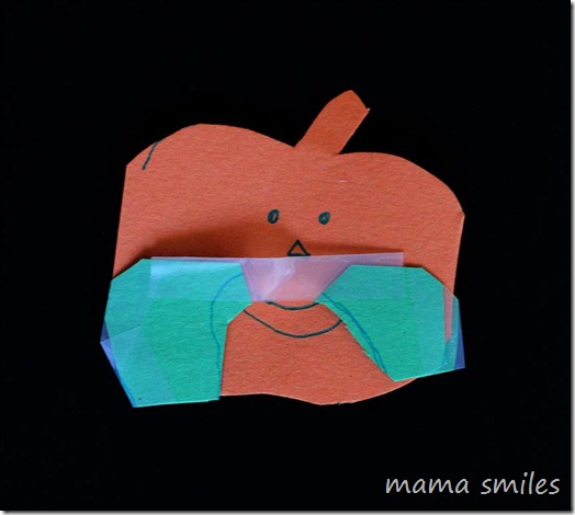 Halloween fun with paper pumpkin cutouts - dressing pumpkins