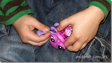 Johnny holds his broken Xia-Xia pet