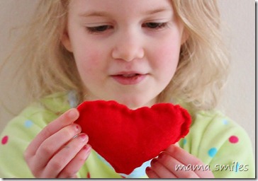 Emma admires the heart she sewed