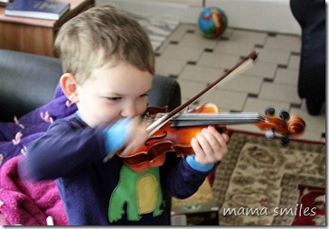 Johnny plays the violin with gusto