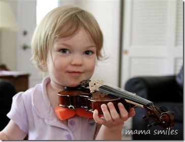 Lily gets ready to play her violin