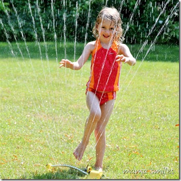 Emma in the sprinkler