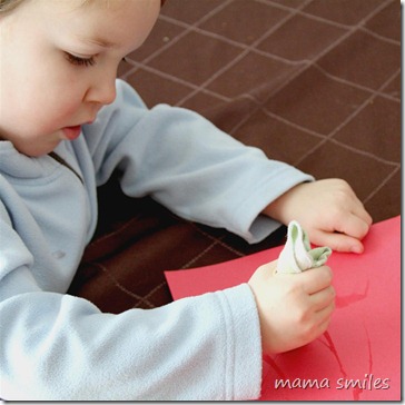 painting with an icicle on construction paper