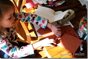 Emma writing a joke book