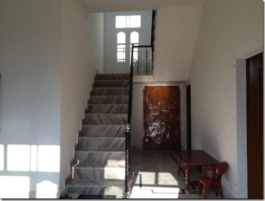inside of house with marble staircase
