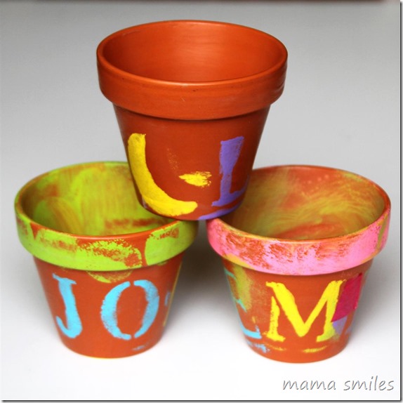 child-painted terra cotta clay pots